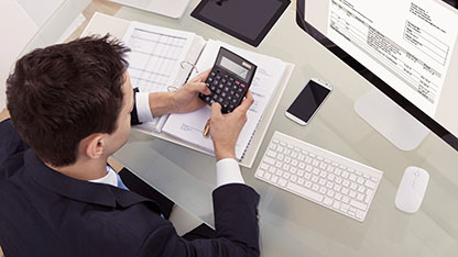 Man using calculator