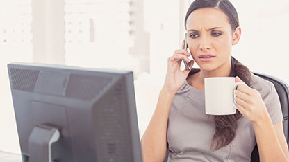 Lady using mobile and computer