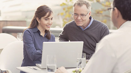 Man and lady using laptop