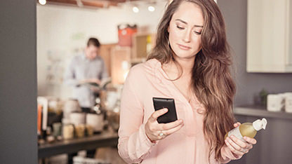 Lady shopping using mobile phone