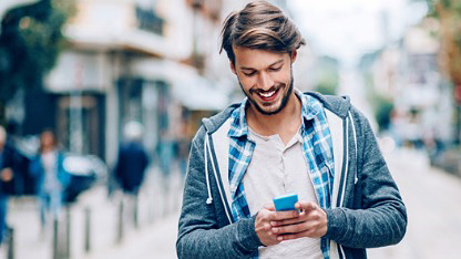 Man using mobile phone in street Man using mobile phone in street