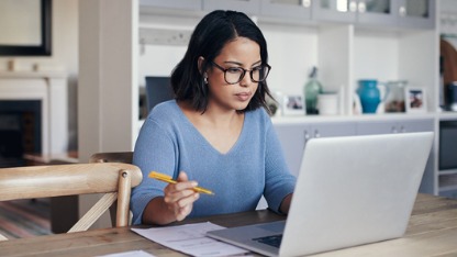 Lady using laptop at home