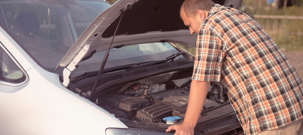 Man with a broken down car