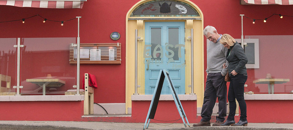Man and lady shopping on high street