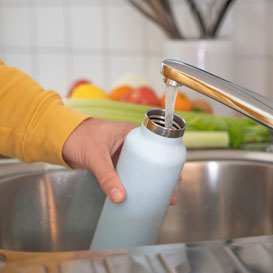 filling reusable bottle